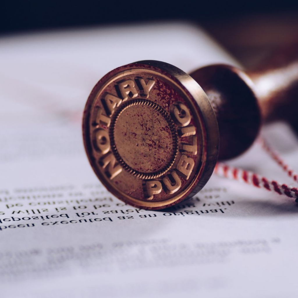 Official notary stamp on legal documents representing professional notary services and document authentication